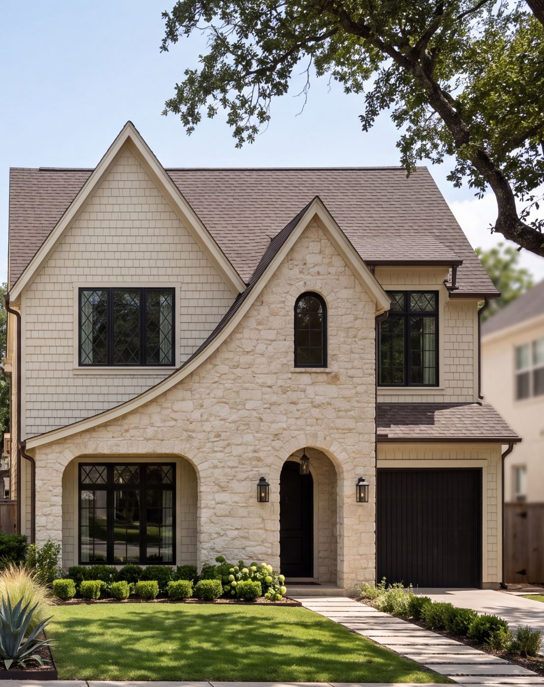 Artist rendering of The Storybook: rough-cut cream limestone front under a curved catslide roofline, shake siding and diamond leaded-glass windows